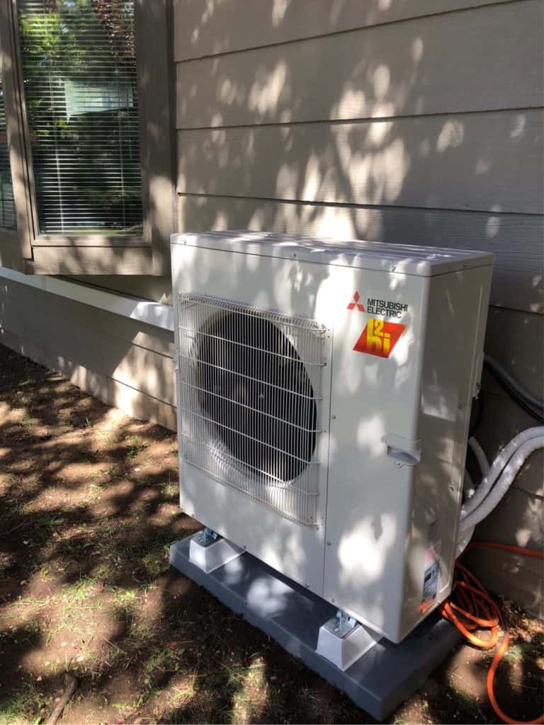 Mitsubishi hyper heat model heat pump outside a Meridian, ID home