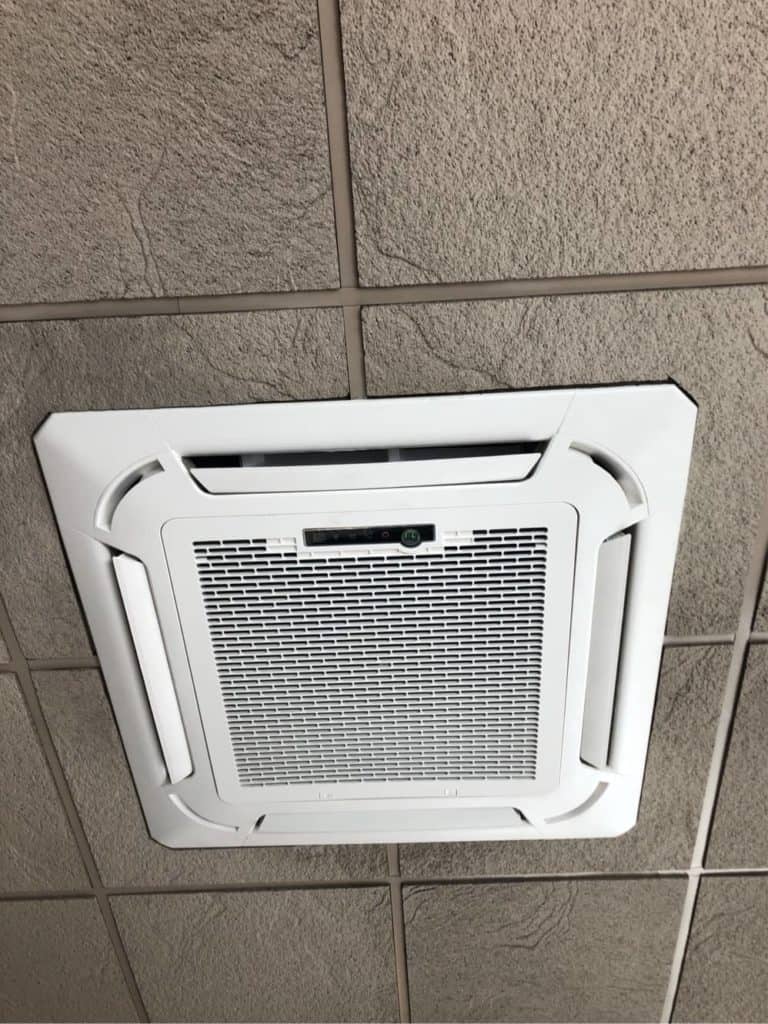 A Ductless Cassette Hangs Overhead Of An Open Space